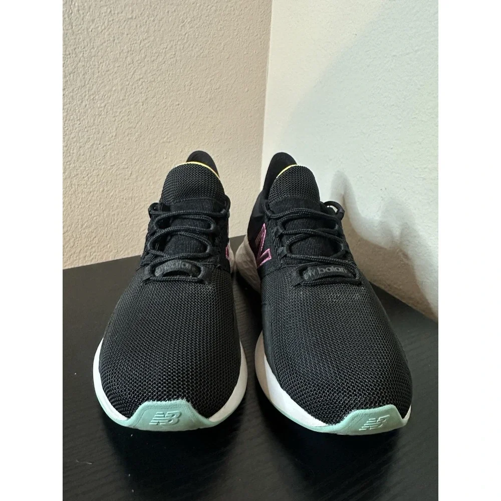 New Balance Black Athletic Sneakers with Pink and Yellow Accents